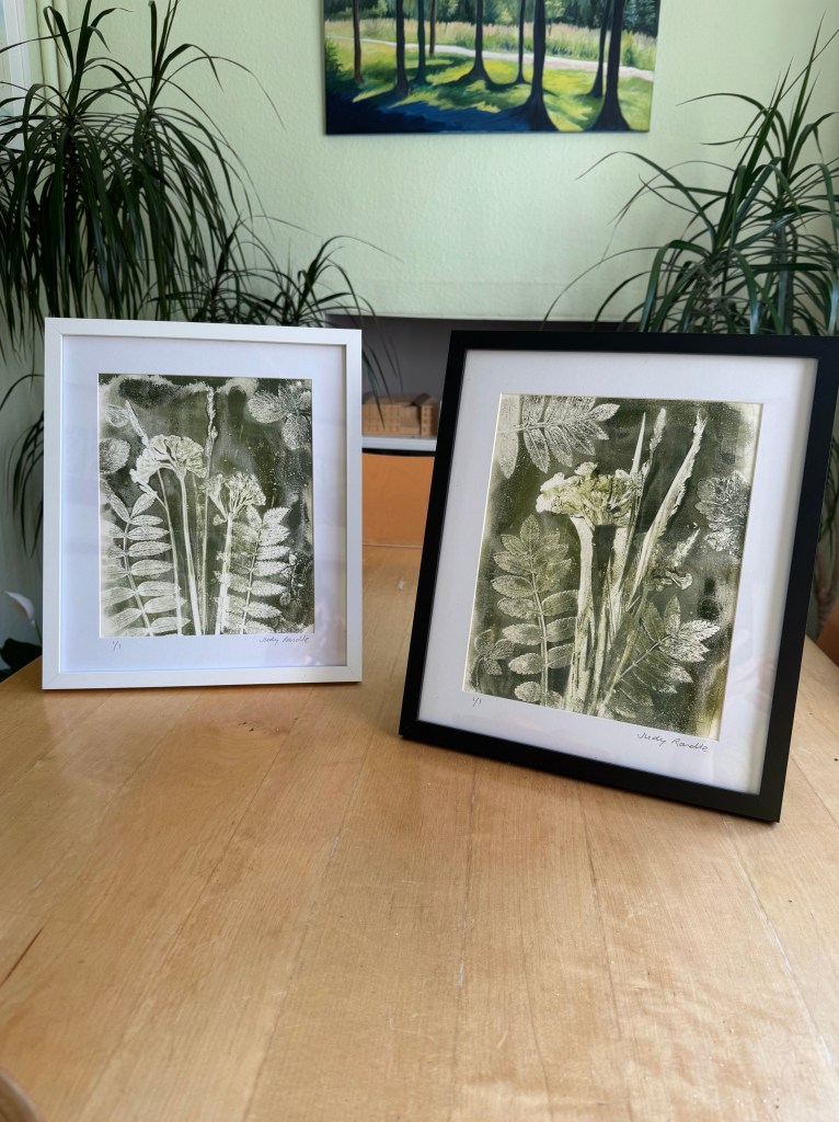 Two gelliplate prints of cowslips and grasses on a table